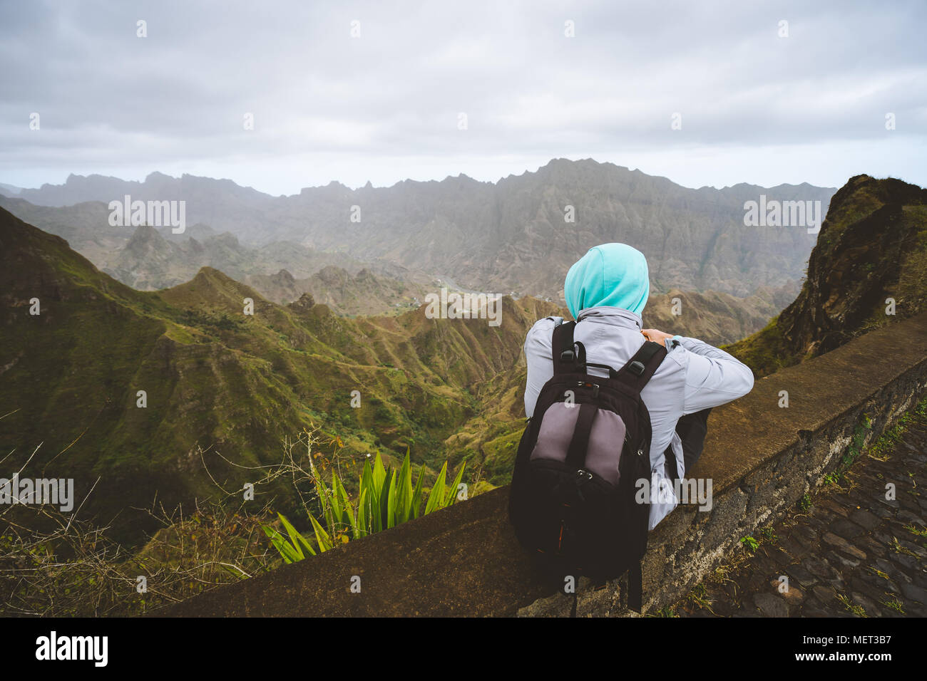 Traveler enjoying magnificent view of huge mountain range on Santo Antao island, Cape Verde Stock Photo