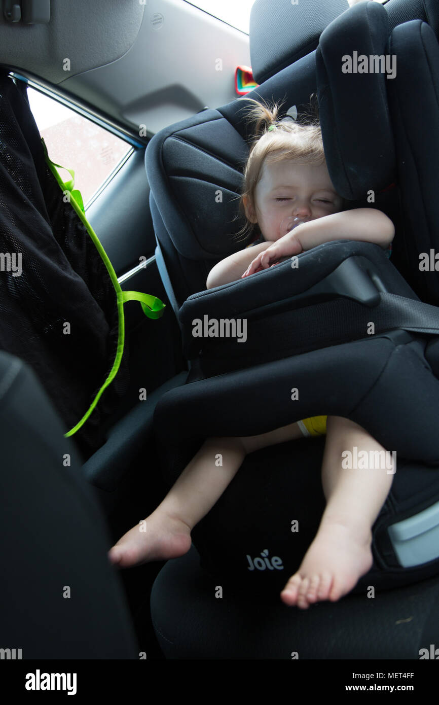 Baby sleeping in car seat Stock Photo Alamy