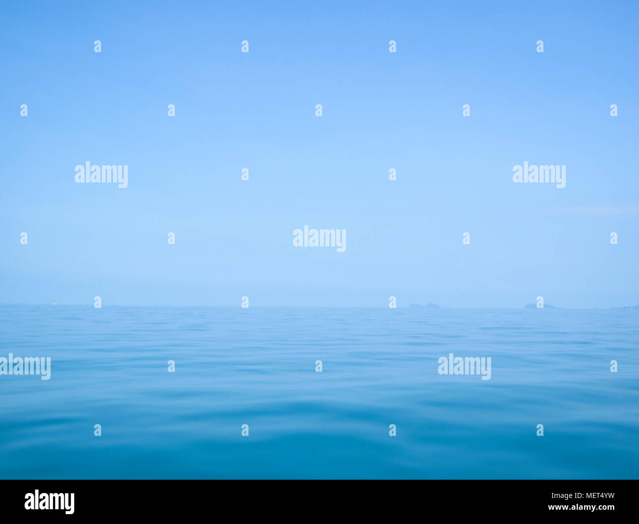 calm flat surface of ocean meeting cloudless clear blue sky at horison, in the gulf of thailand between koh samui and ko phangan Stock Photo