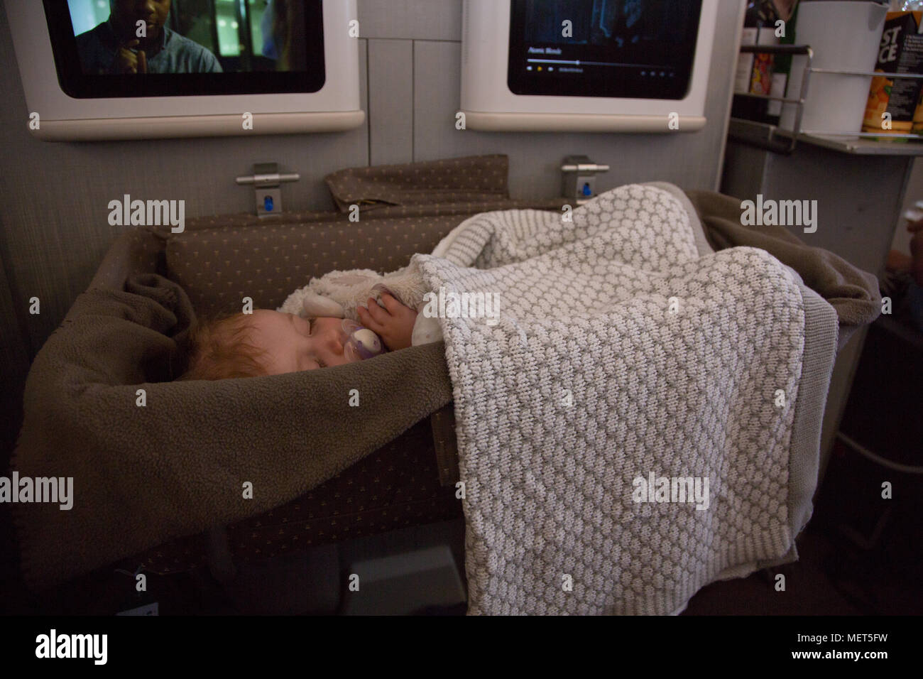 Baby sleeping on long haul flight Stock Photo Alamy