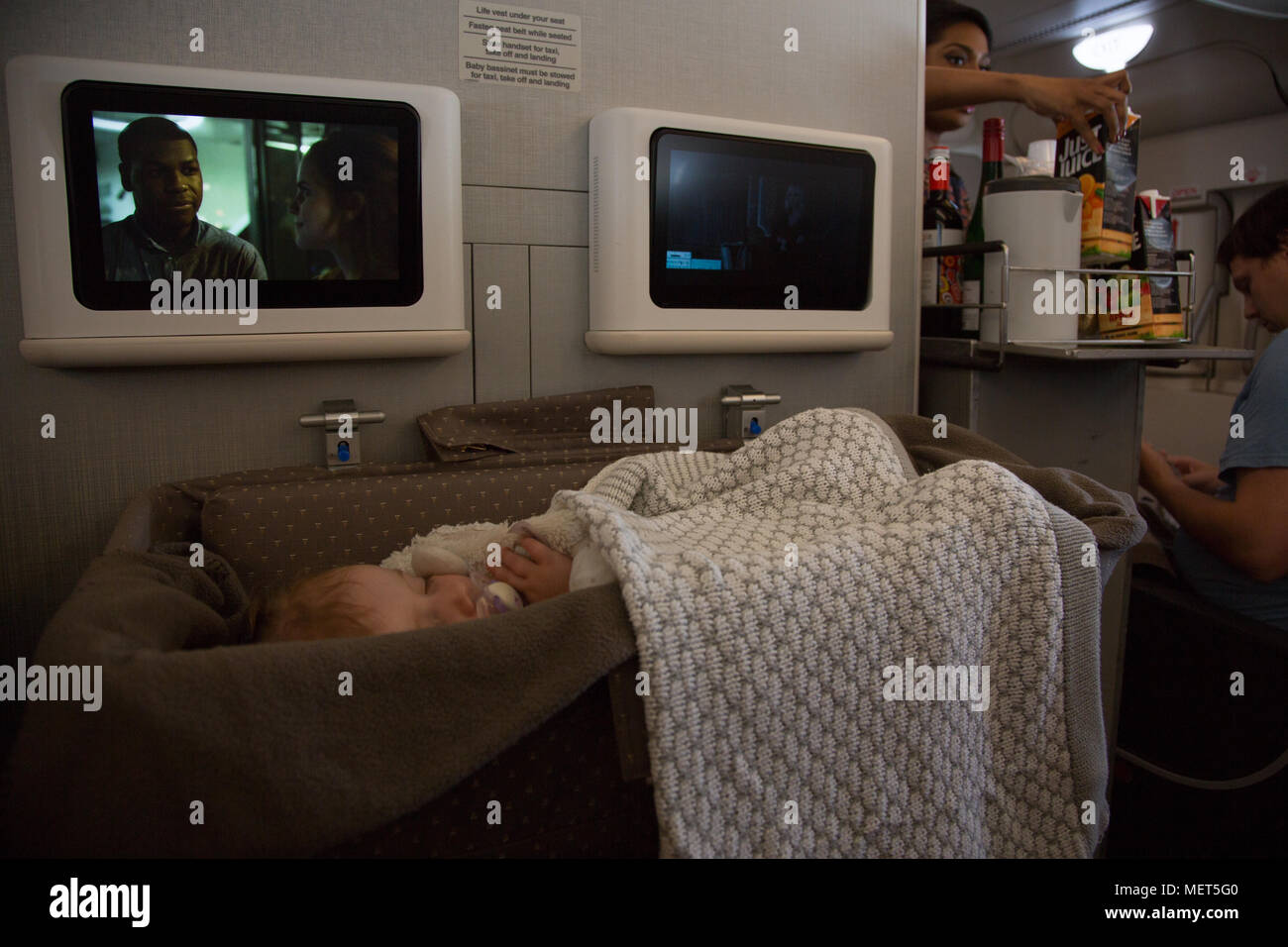 Baby sleeping on long haul flight Stock Photo Alamy