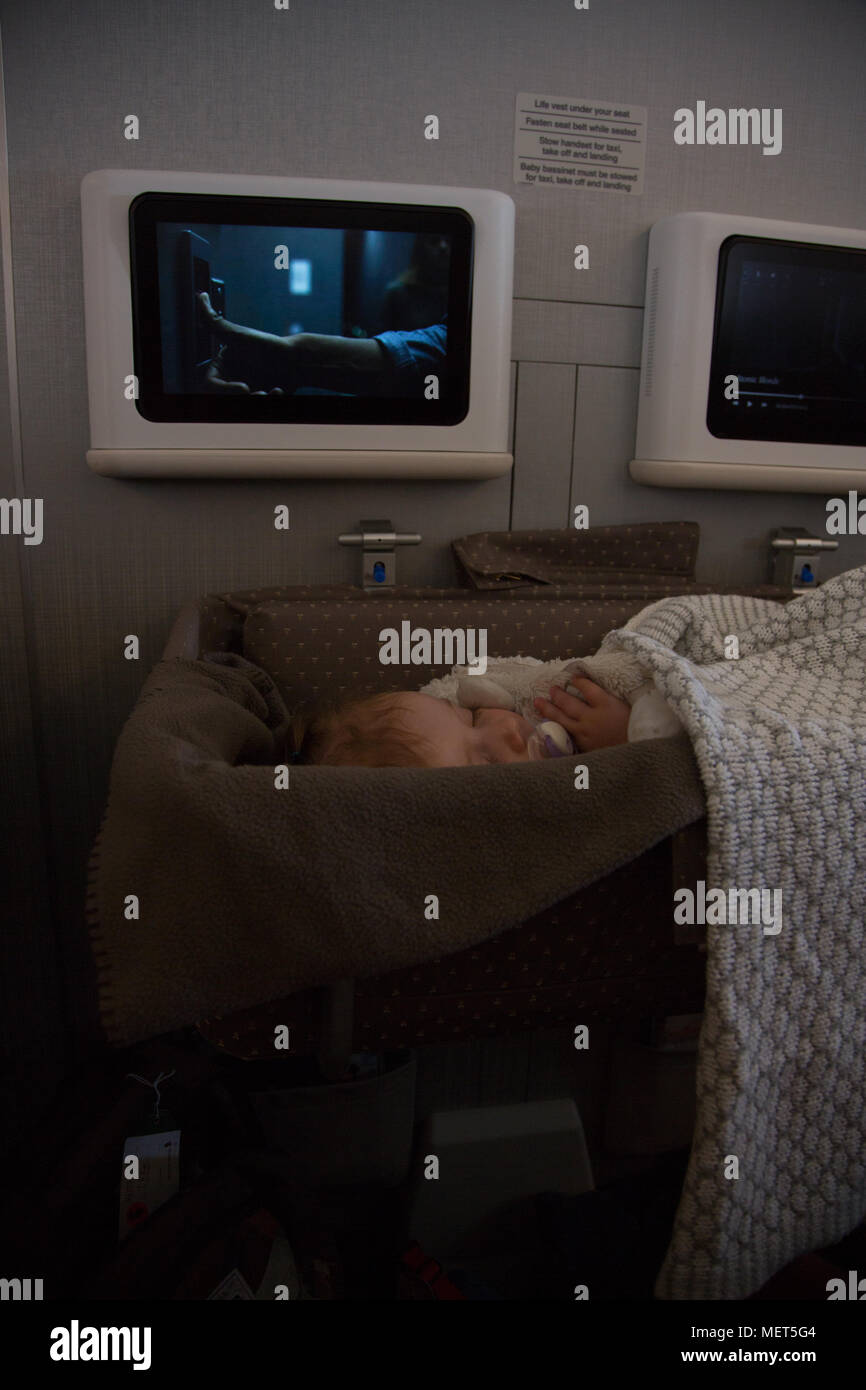 Baby sleeping on long haul flight Stock Photo Alamy