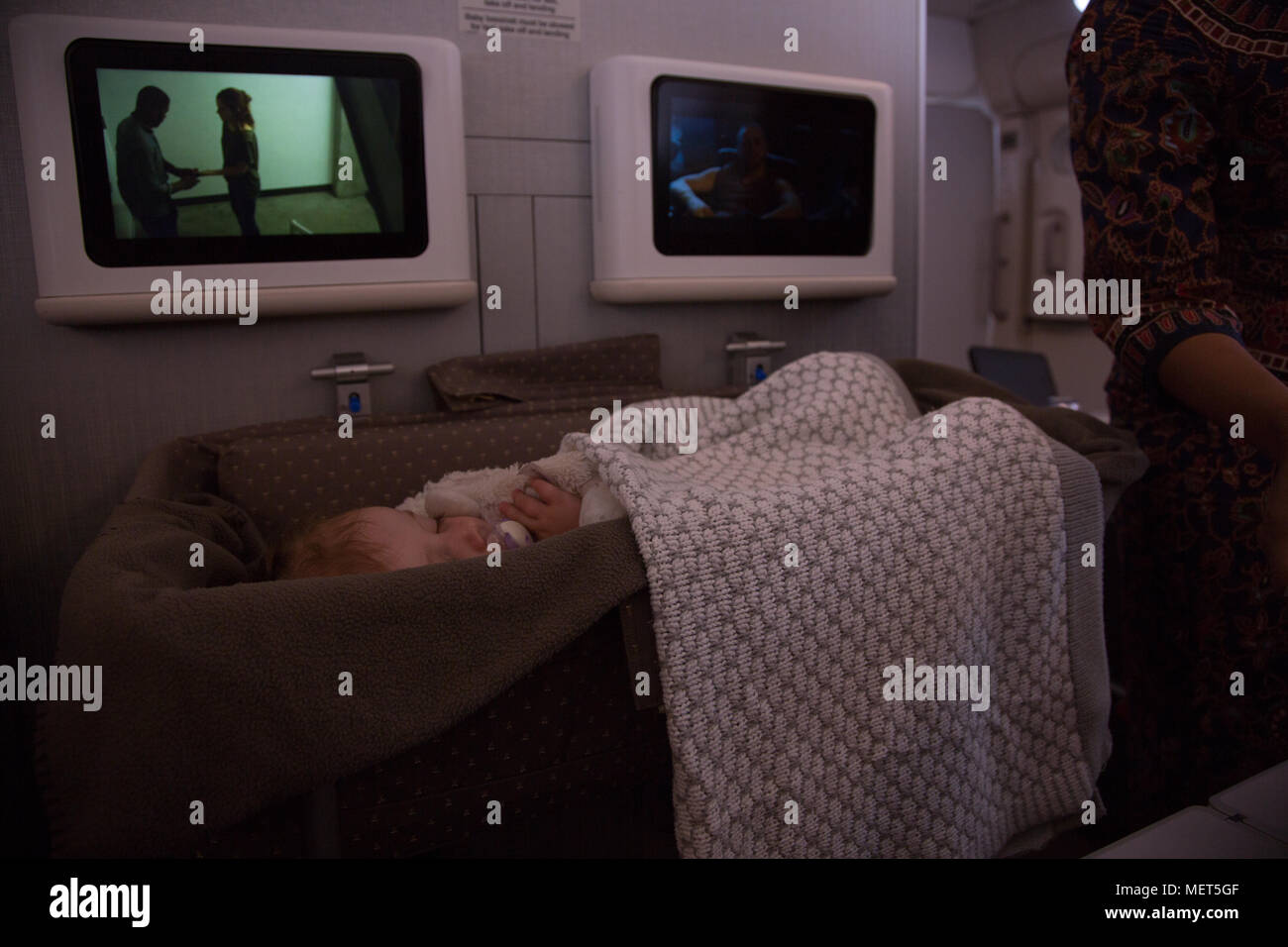 Baby sleeping on long haul flight Stock Photo Alamy