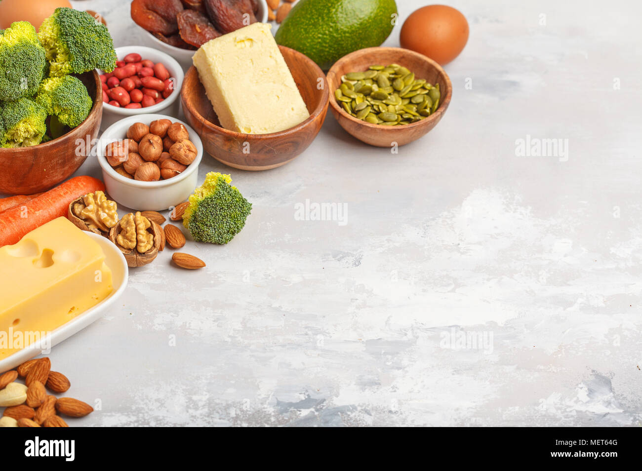 Healthy food nutrition dieting concept. Assortment of high vitamin A sources. Carrots, nuts