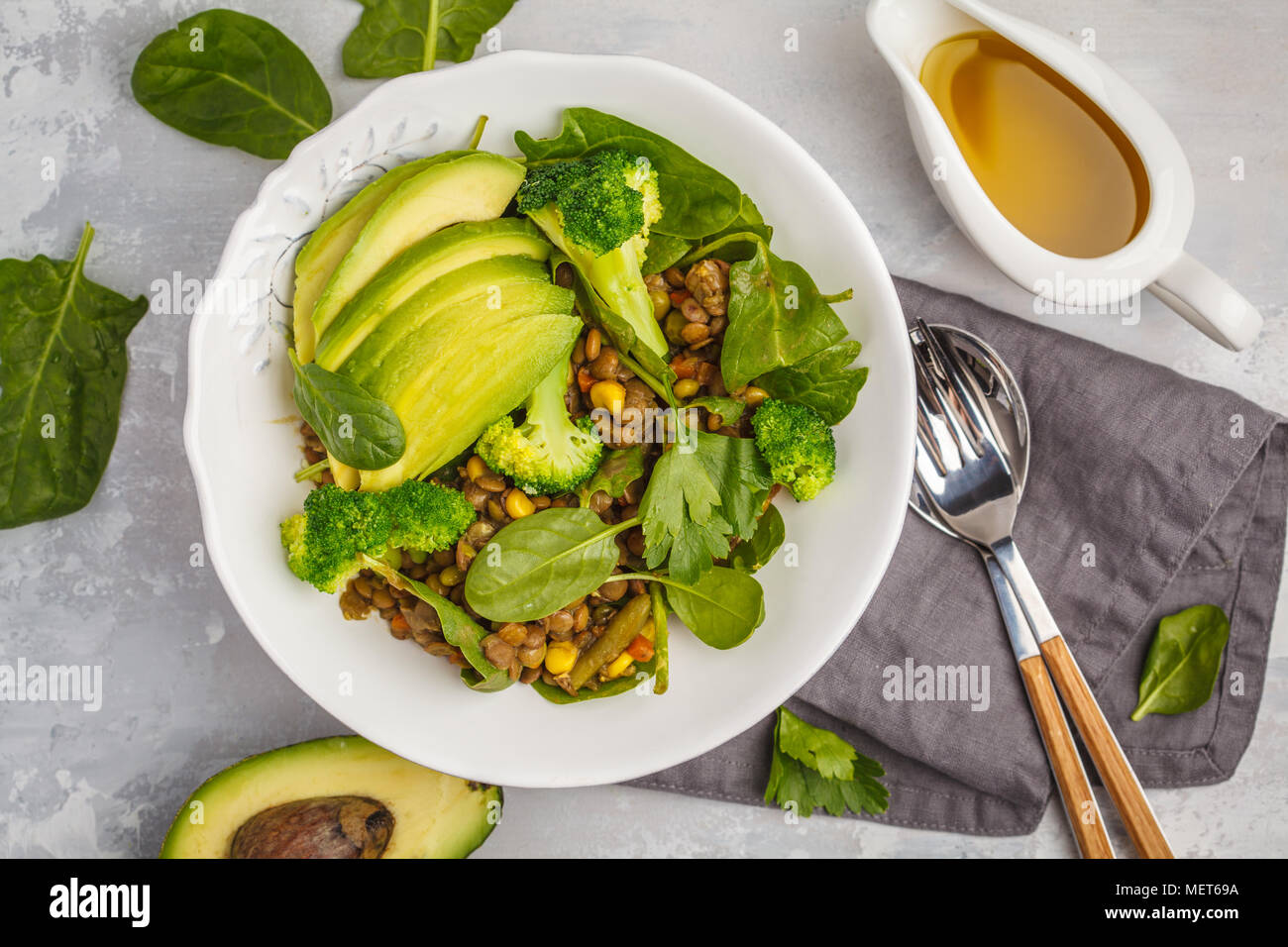 Lentil green curry salad with broccoli and avocado. Healthy vegan food concept. Stock Photo