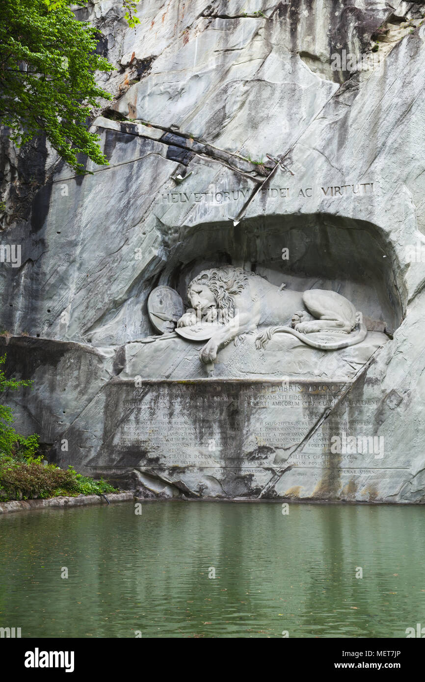 Lucerne, Switzerland - May 7, 2017: Lion of Lucerne, a rock relief in Lucerne, Switzerland, designed by Bertel Thorvaldsen and hewn in 1820–1821 by Lu Stock Photo