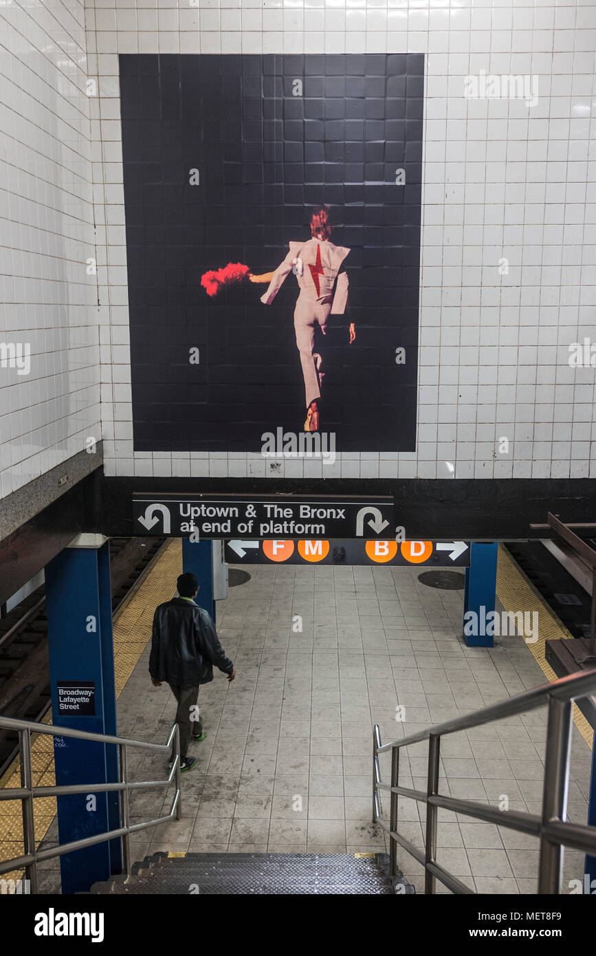 New York, USA. 121 April, 2018. Images of David Bowie at thee Broadway-Lafayette subway station.  The installation, sponsorsed  by Spotify, is being held in conjunction with the exhibition 'David Bowie IS' at the Brooklyn. The subway installation is just blocks from where the late rock star lived in Soho. The art will be on display until mid May. ©Stacy Walsh Rosenstock Stock Photo
