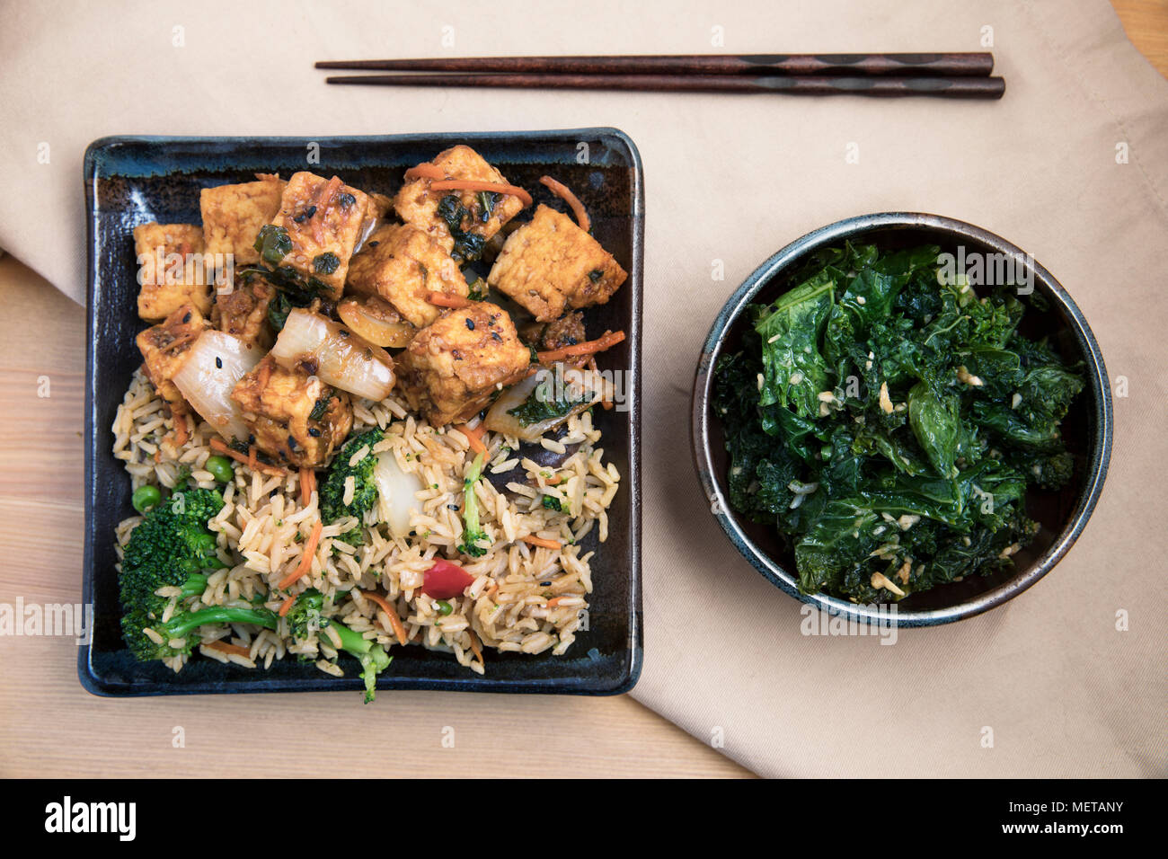 Fried tofu with rice and vegetable stir fry vegan asian meal Stock
