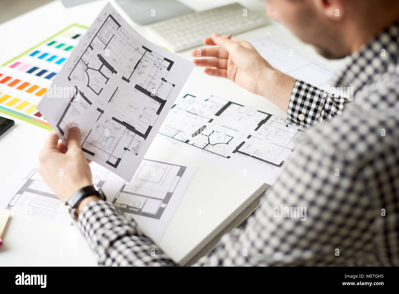interior-designer-concentrated-on-work-METGH5.jpg