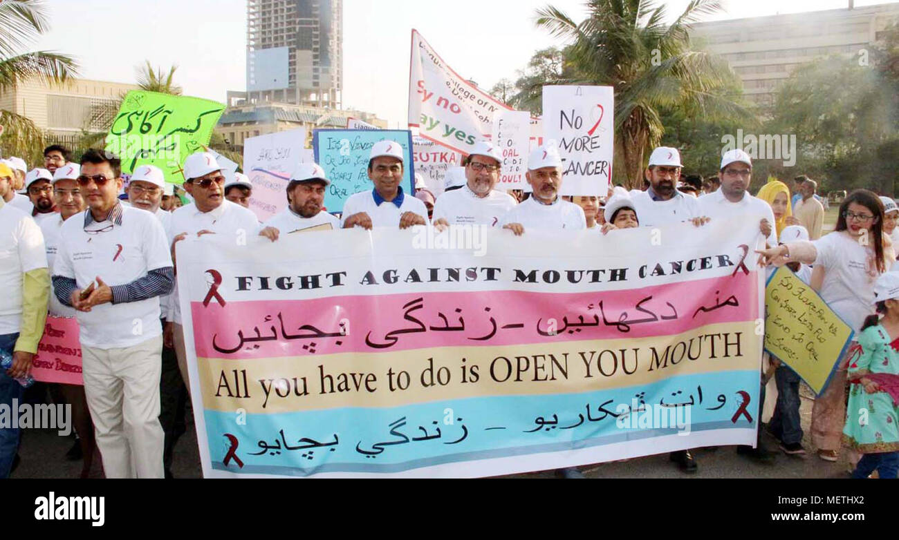 Students of Karachi Medical and Dental College are holding awareness walk against Cancer organized by Karachi Metropolitan Corporation, at Fatima Jinnah road in Karachi on Sunday, April 22, 2018. Stock Photo