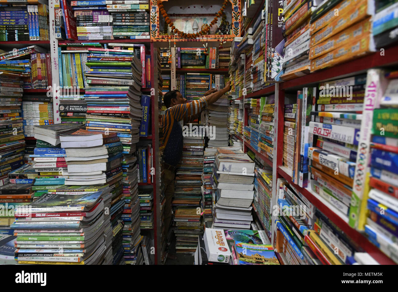 Tripura, India. 23rd Apr, 2018. A book seller works in a book shop in Agartala, capital of northeastern Indian state of Tripura, on April 23, 2018. The United Nations Educational, Scientific and Cultural Organization (UNESCO) designated April 23 as World Book Day in 1995 to pay tribute to books and authors and to encourage people to discover the pleasure of reading. Credit: Stringer) (hy/Xinhua/Alamy Live News Stock Photo