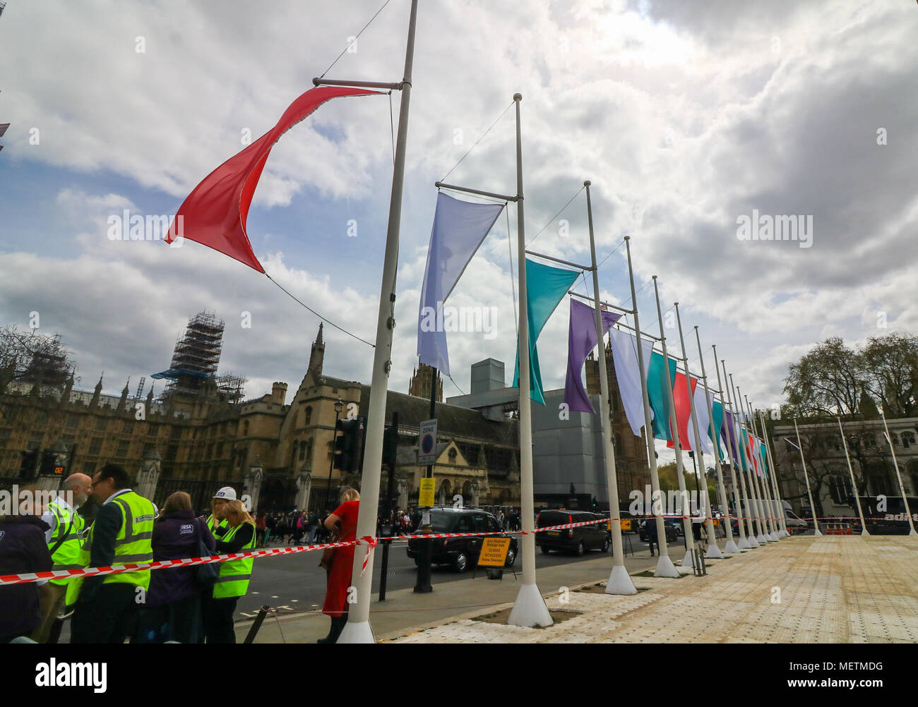 London UK. 23rd April 2018. Coloured Flags representing the Sufragette movement hang in Parliament Square in honour of Millicent Fawcett ,a British feminist, political and union leader, who campaigned for women to have the vote. In 1908 Emmeline Pethick-Lawrence, designed the suffragettes' colour scheme of purple for loyalty and dignity, white for purity, and green for hope Credit: amer ghazzal/Alamy Live News Stock Photo