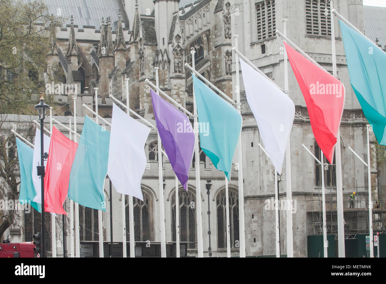 London UK. 23rd April 2018. Coloured Flags representing the Sufragette movement hang in Parliament Square in honour of Millicent Fawcett ,a British feminist, political and union leader, who campaigned for women to have the vote. In 1908 Emmeline Pethick-Lawrence, designed the suffragettes' colour scheme of purple for loyalty and dignity, white for purity, and green for hope Credit: amer ghazzal/Alamy Live News Stock Photo