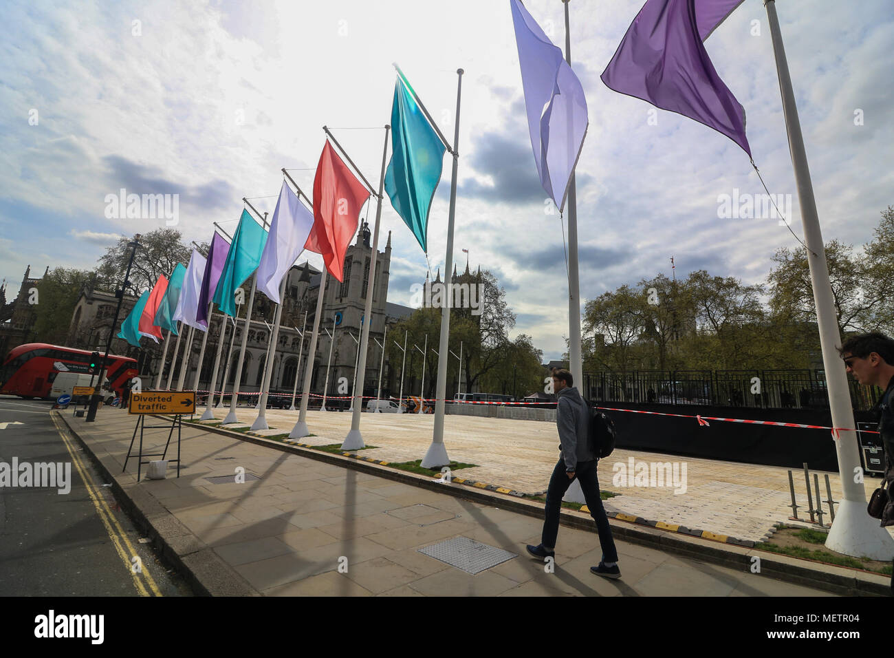 London UK. 23rd April 2018. Coloured Flags representing the Sufragette movement hang in Parliament Square in honour of Millicent Fawcett ,a British feminist, political and union leader, who campaigned for women to have the vote. In 1908 Emmeline Pethick-Lawrence, designed the suffragettes' colour scheme of purple for loyalty and dignity, white for purity, and green for hope Credit: amer ghazzal/Alamy Live News Stock Photo