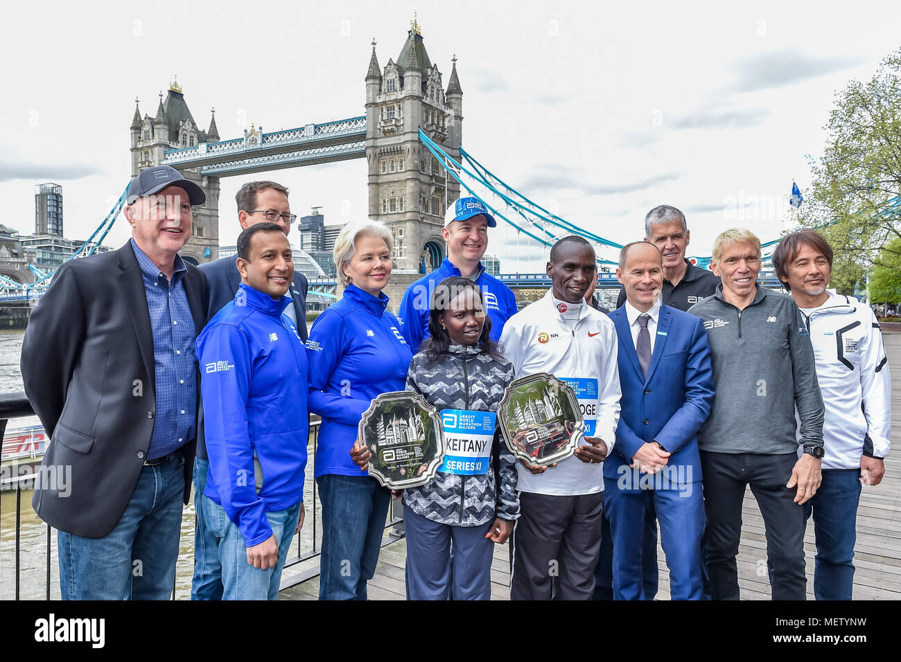 London, UK. 23rd April, 2018. Kenyan Eliud Kipchoge and Mary Keitany  with VMLM officials at Winners presentation after the 2018 Virgin Money London Marathon on Monday, 23 April 2018. London, England. Credit: Taka Wu/Alamy Live News Stock Photo