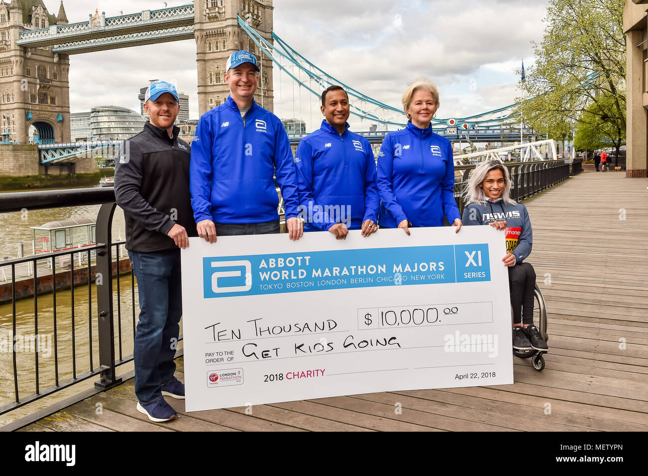 London, UK. 23rd April, 2018. Madison de Rozario (AUS) with the VMLM officials at Winners presentation after the 2018 Virgin Money London Marathon on Monday, 23 April 2018. London, England. Credit: Taka Wu/Alamy Live News Stock Photo