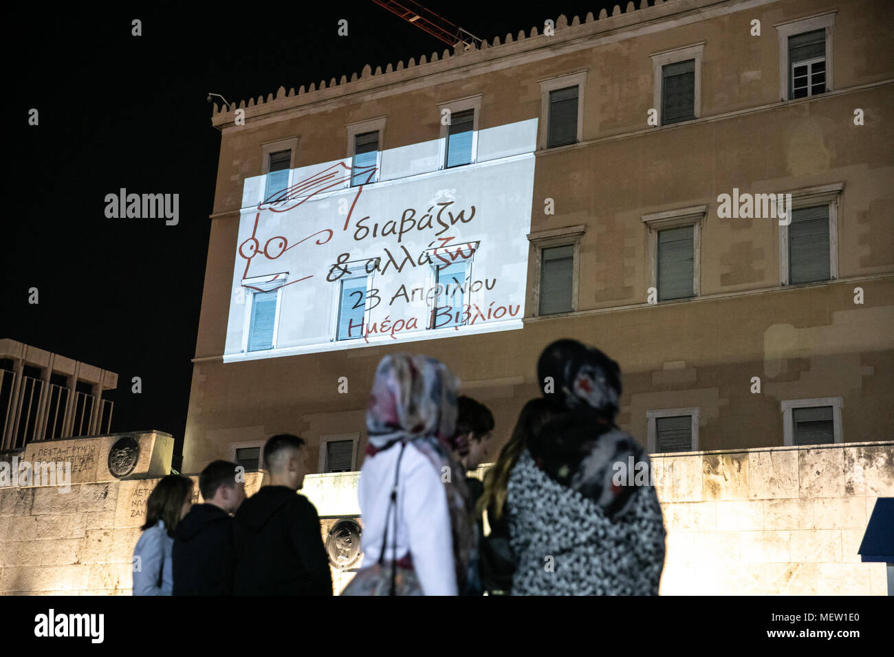 Athens. 23rd Apr, 2018. Photo taken on April 23, 2018 shows a cartoon image projected on the parliament building to celebrate Athens' taking over as World Book Capital for 2018 in Athens, Greece. Athens marked World Book Day on Monday with a celebratory event hosted at the Acropolis Museum, as it took over as World Book Capital for 2018. Credit: Lefteris Partsalis/Xinhua/Alamy Live News Stock Photo