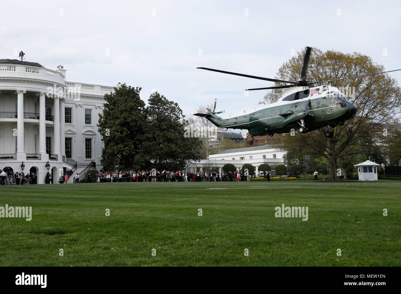 Marine One helicopter with U.S. President Donald Trump, France's president Emmanuel Macron and First Ladies Melania Trump and Brigitte Macron on board departs on the South Lawn of the White House in Washington, DC, U.S., on Monday, April 23, 2018. As Macron arrives for the first state visit of Trump's presidency, the U.S. leader is threatening to upend the global trading system with tariffs on China, maybe Europe too. Credit: Yuri Gripas/Pool via CNP /MediaPunch Stock Photo