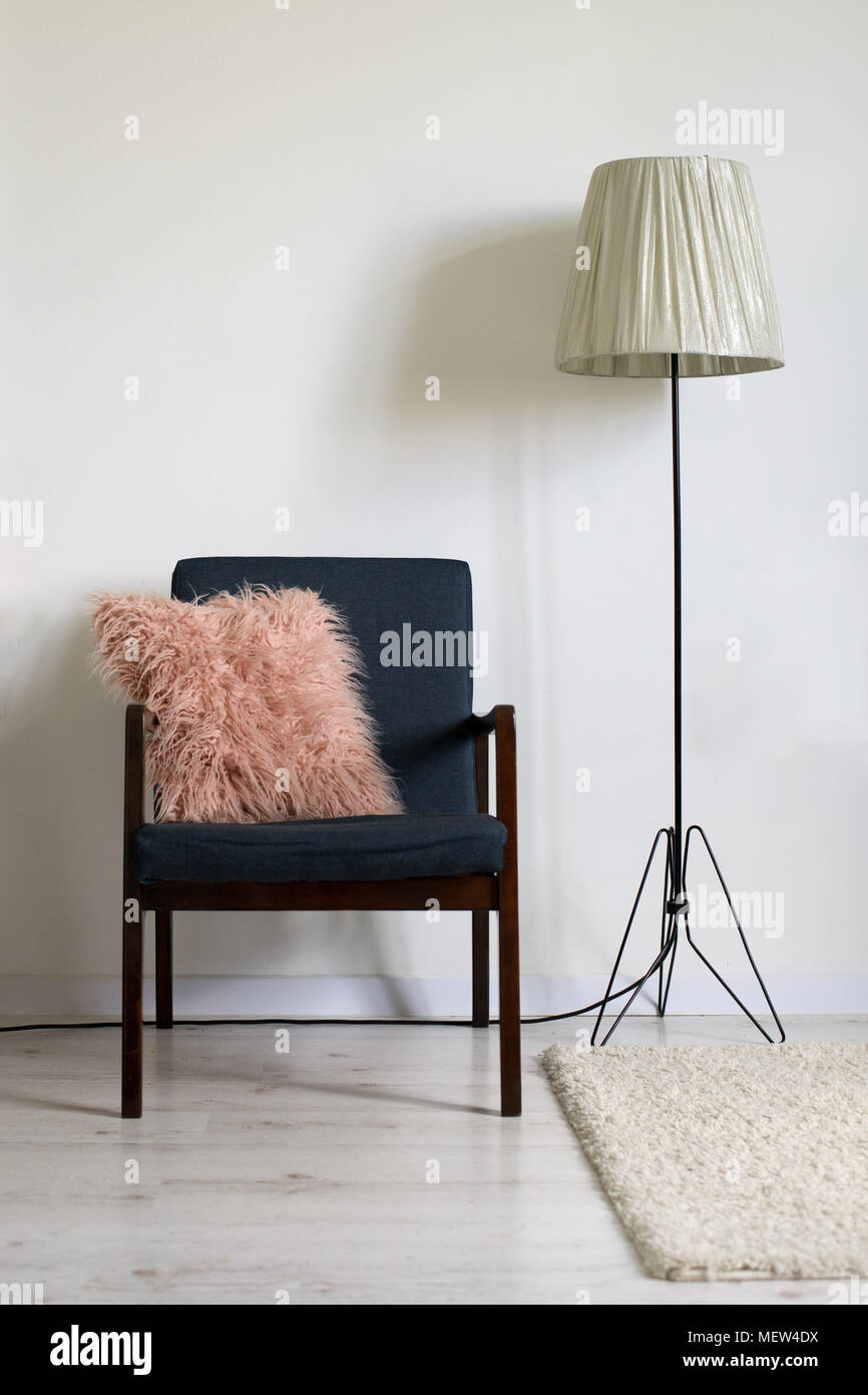 Vintage armchair in minimal interior Stock Photo - Alamy