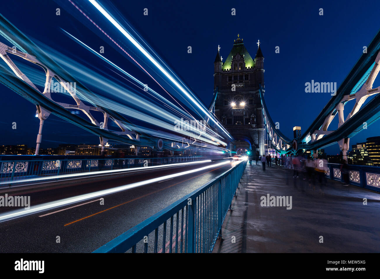 Traffic light trails on Tower Bridge in London city at night Stock ...