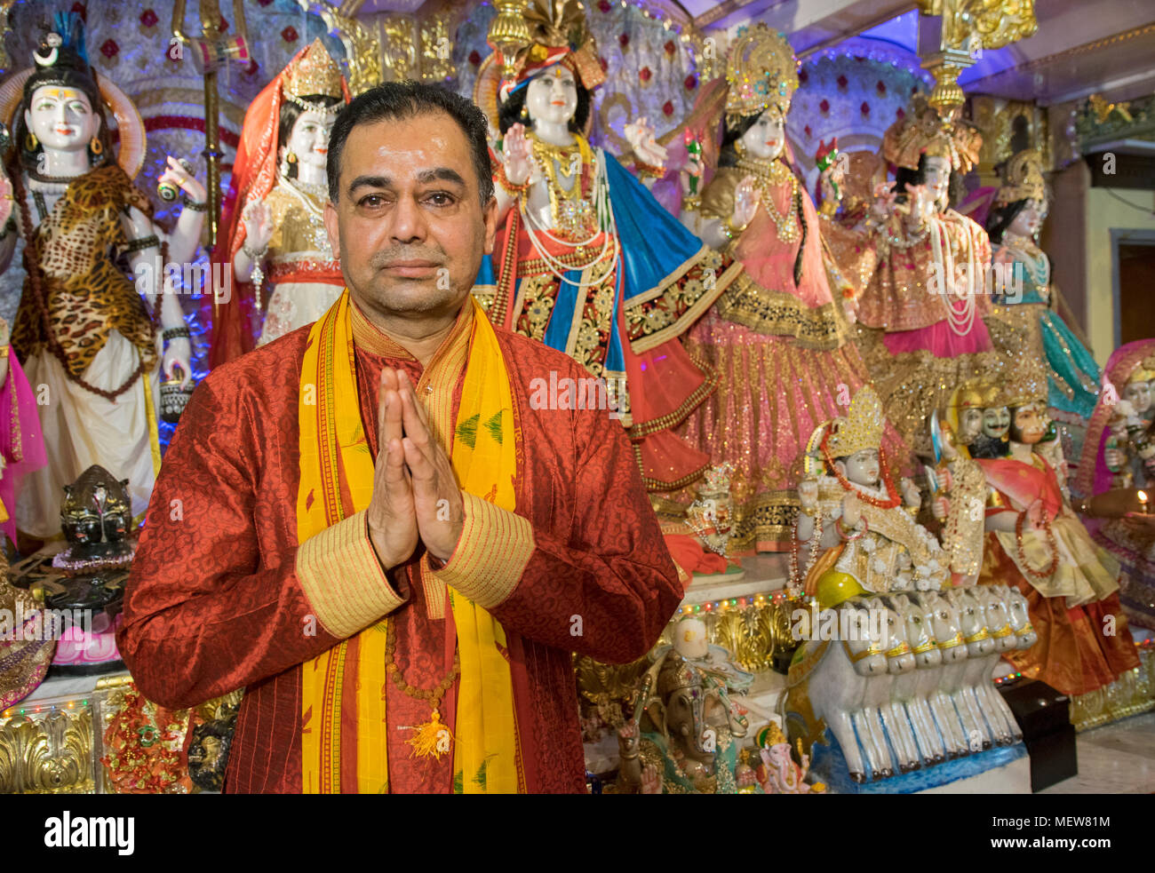 Posed portrait of a Hindu priest - or pandit  - at the Shri Lakshmi Narayan Mandir  temple in Richmond Hill, Queens, New York. Stock Photo