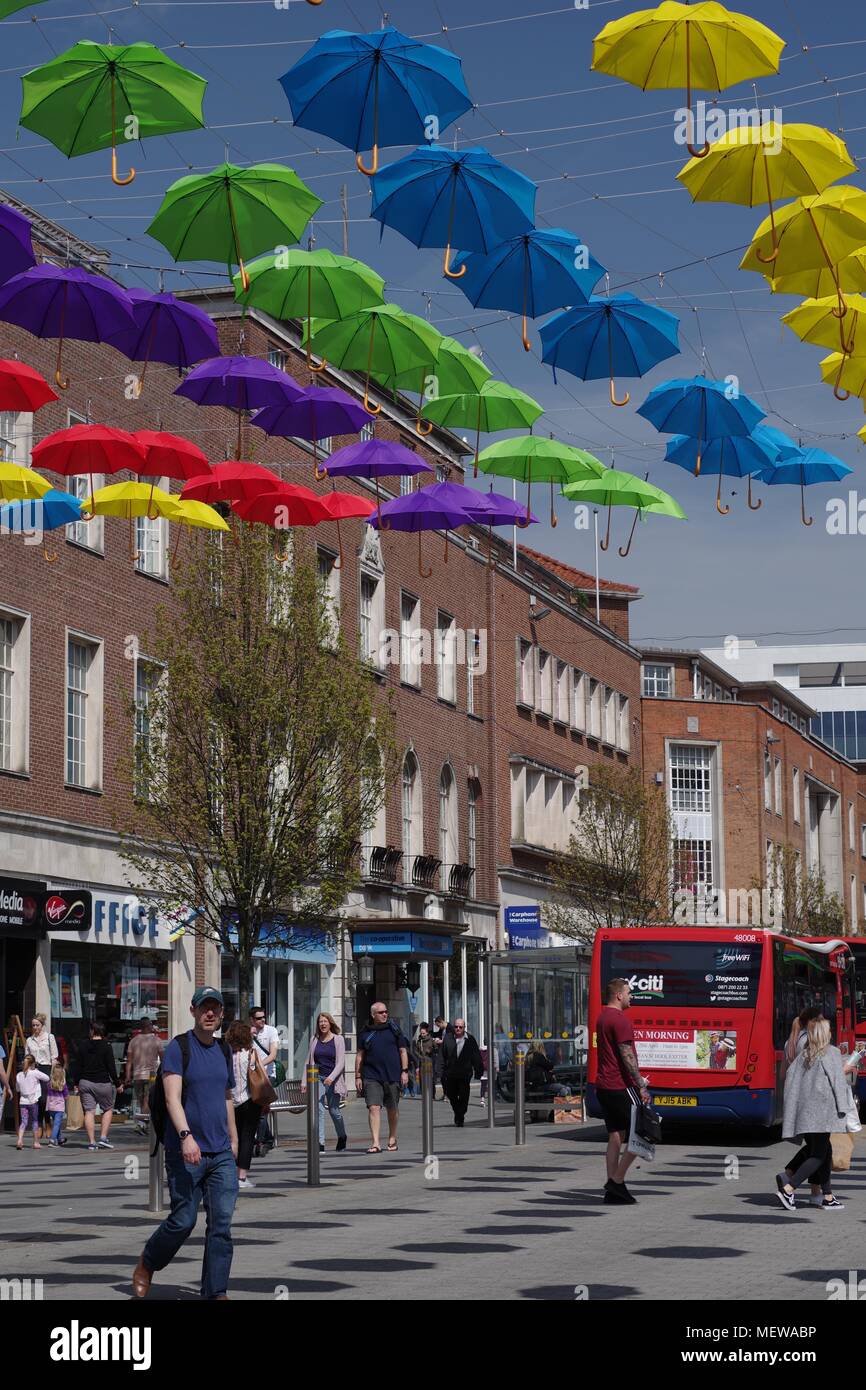 Balloon Seller on Exeter High Street, with the Exeter Riddle Obelisk