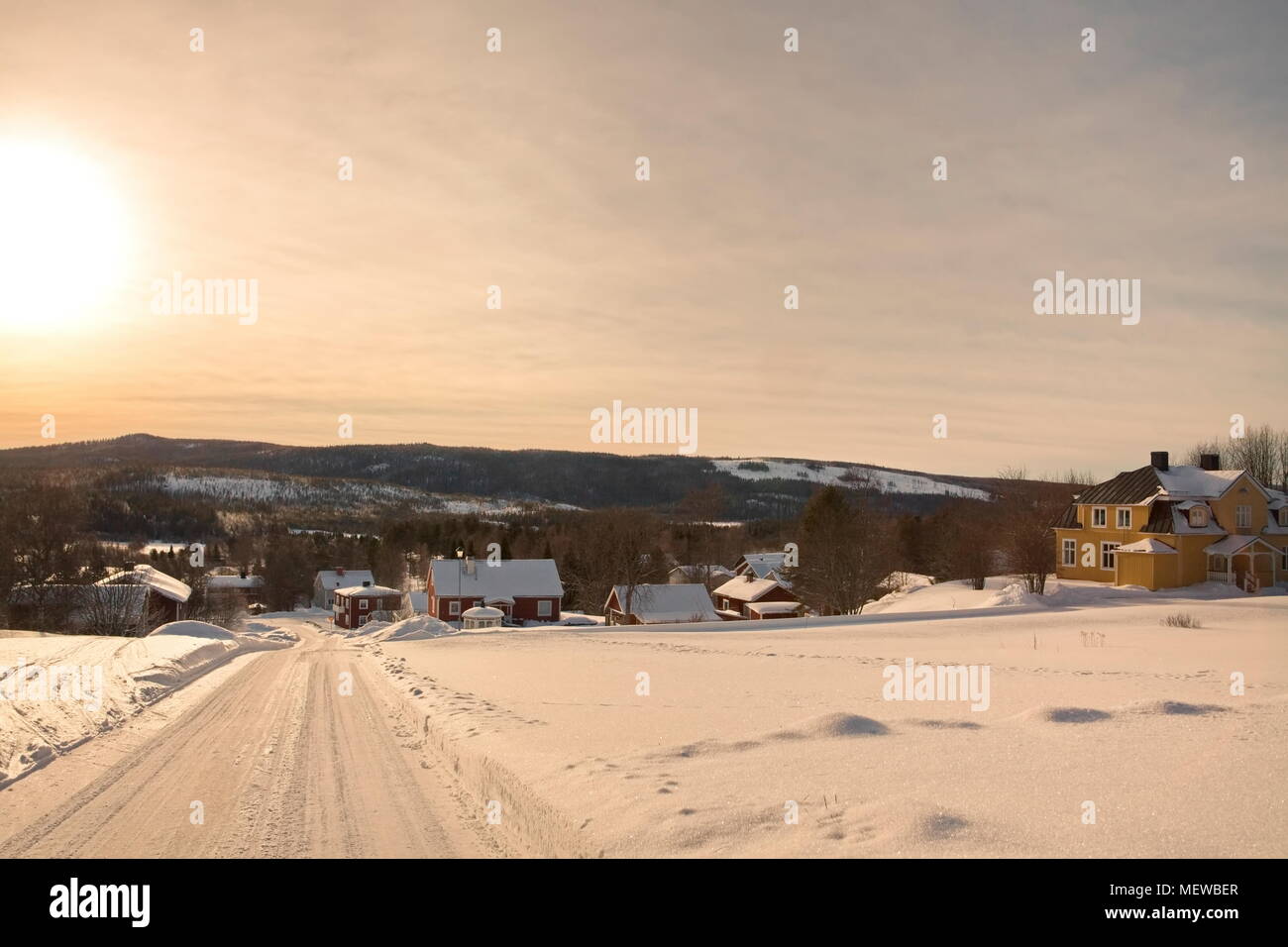 Village Solberg in northern Sweden covered in snow on a sunny winter morning. Stock Photo