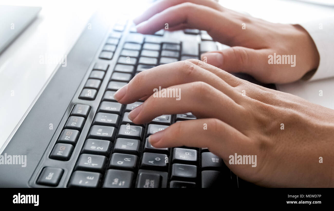 Closeup shot of female fingers on computer keyboard at office Stock ...