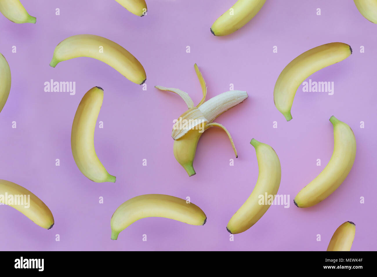 Fresh yellow bananas on pink background Stock Photo