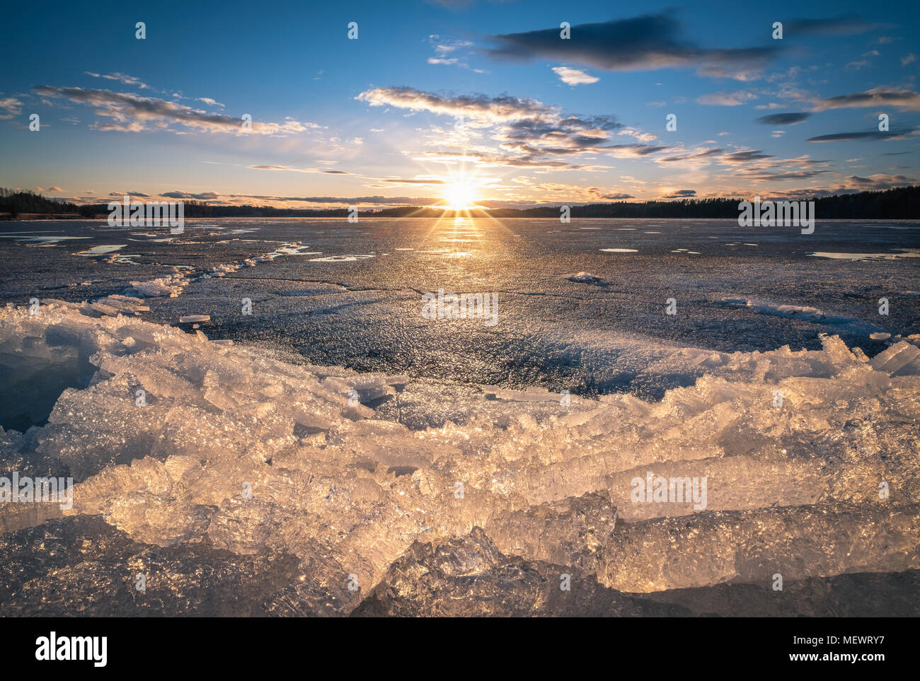 Scenic landscape with sunset and melting ice at beautiful evening in Finland Stock Photo