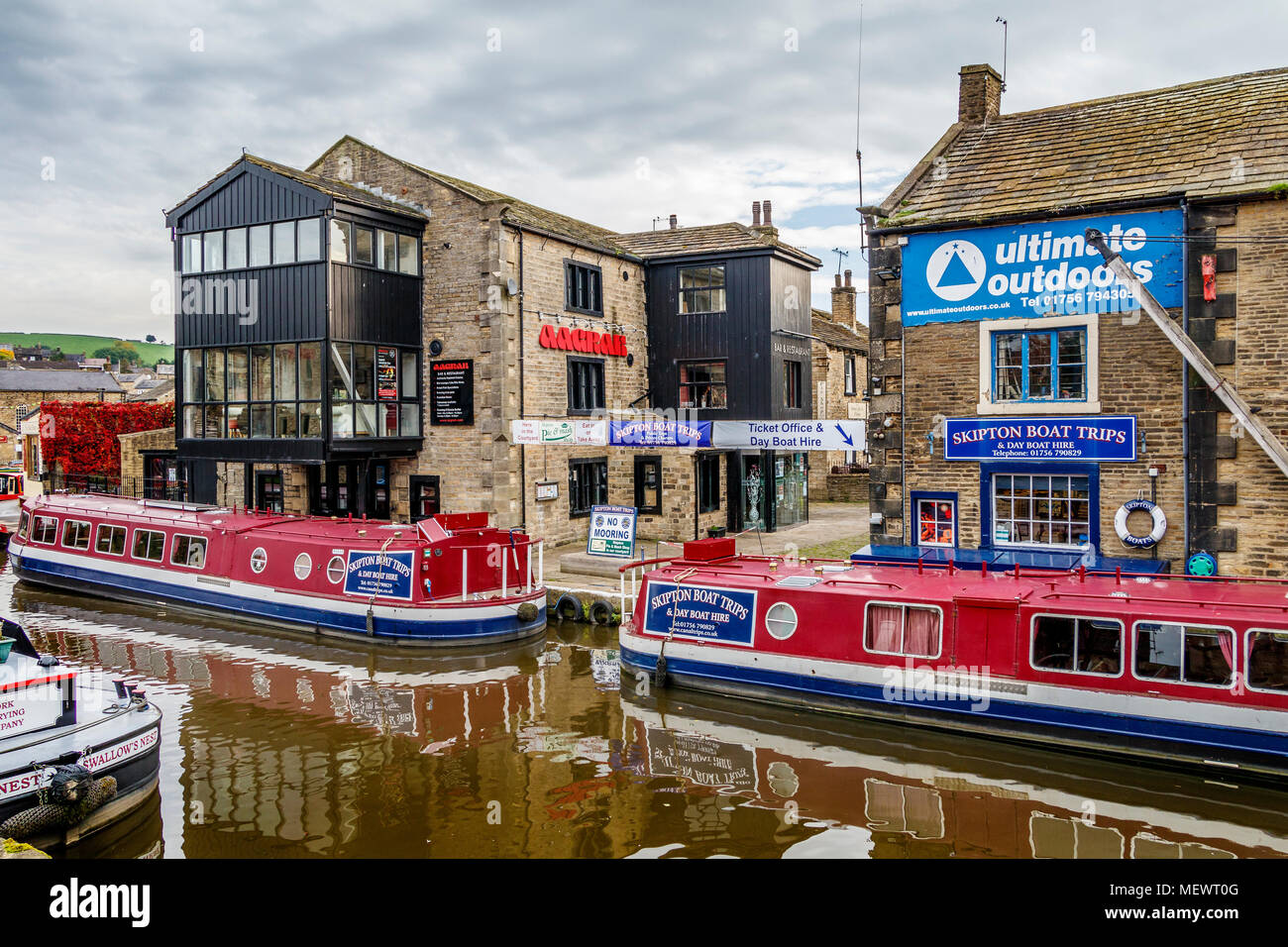 Narrow boats moored on the Leeds and Liverpool Canal at Skipton in North Yorkshire, UK. Stock Photo