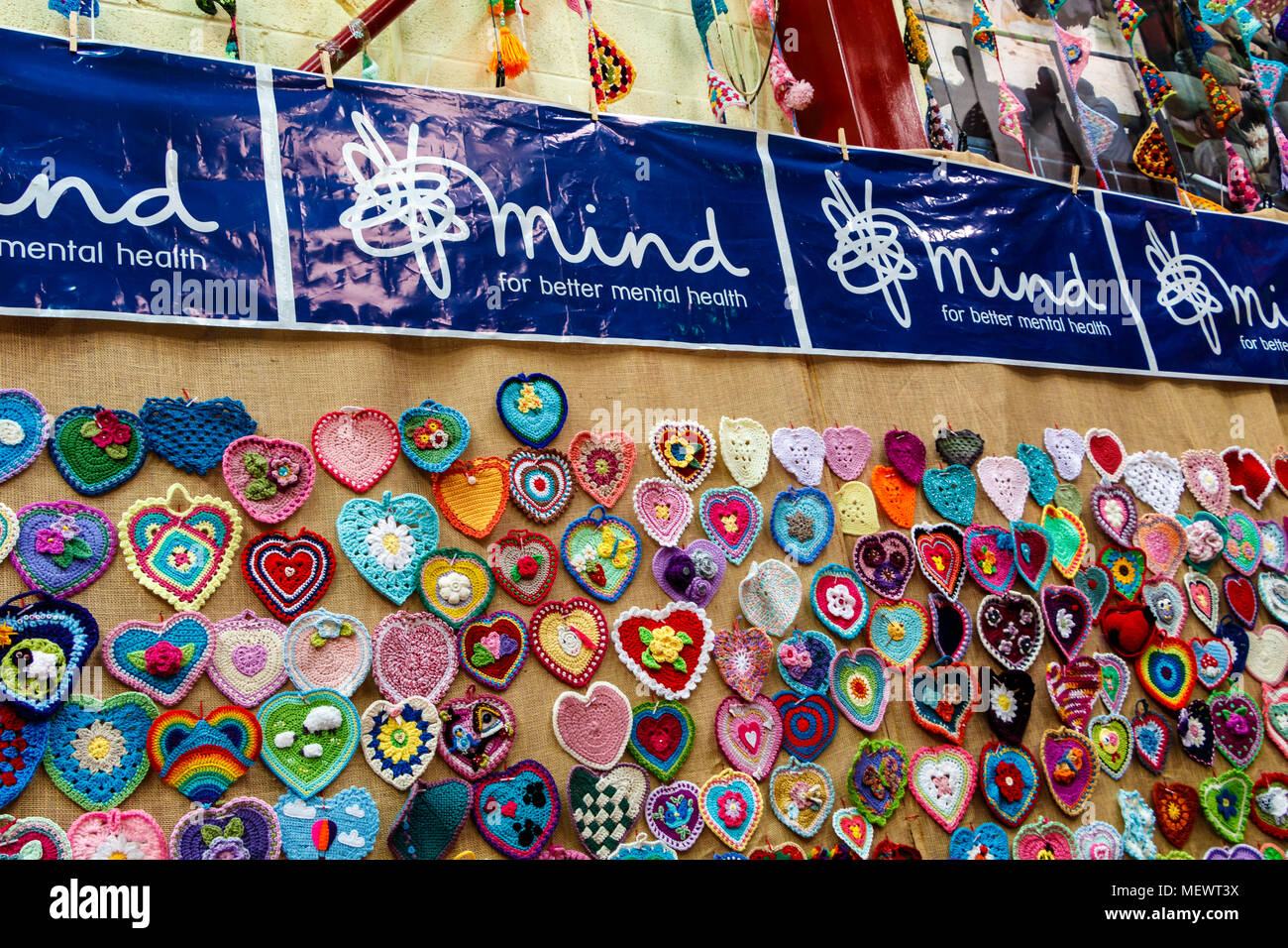 The mental health charity Mind with their display of knitted love hearts at Yarndale, Skipton, North Yorkshire, UK. Stock Photo