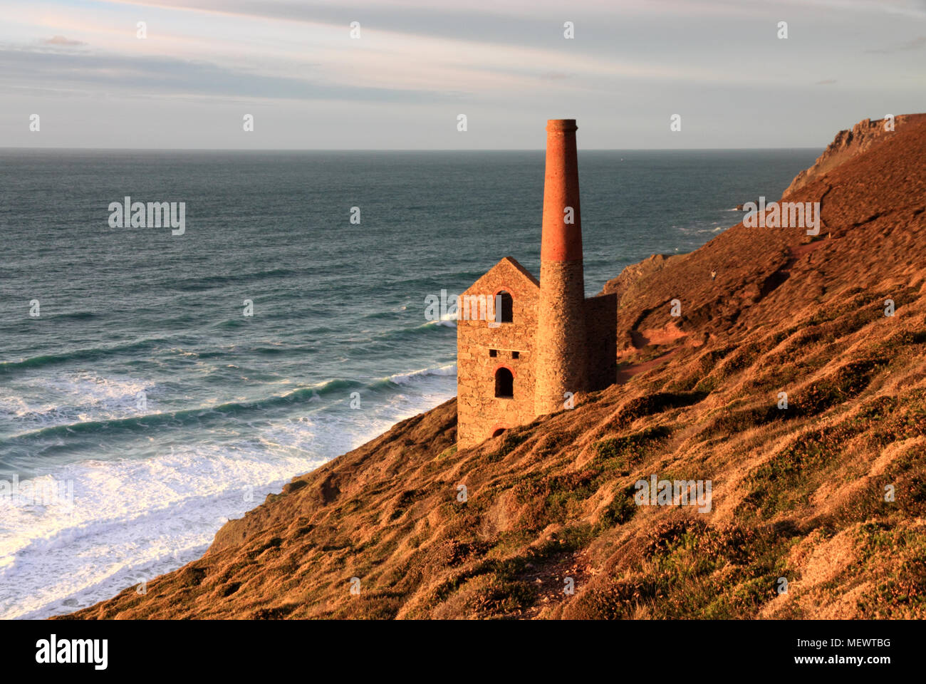 Wheal Coates engine house, St Agnes, is illuminated by the setting sun. Stock Photo