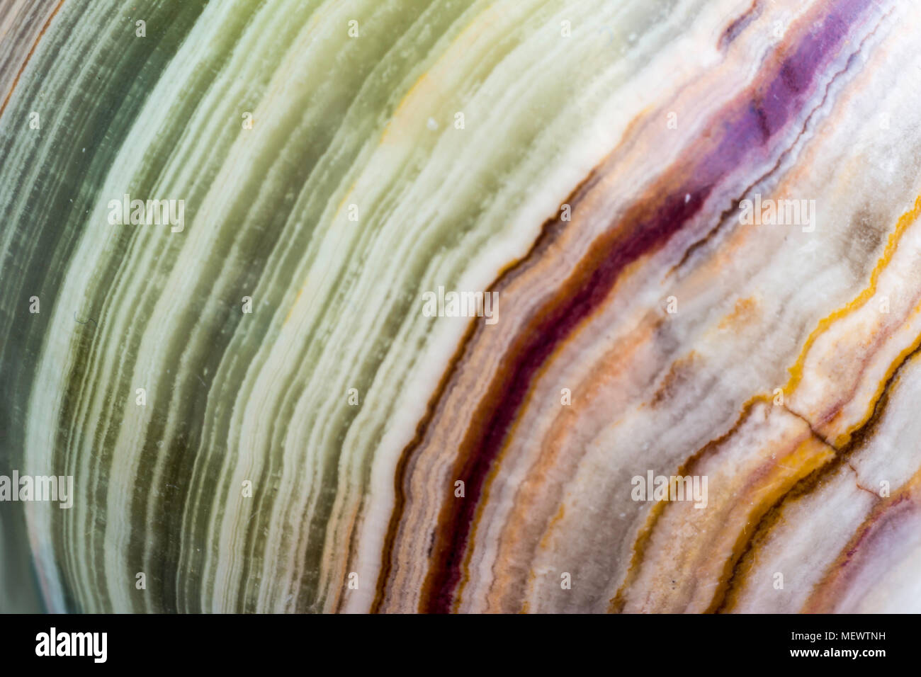 Macro photo texture of polished onyx stone. Photo for the site about geology, stones, jewelry, handwork, textures, art. Stock Photo