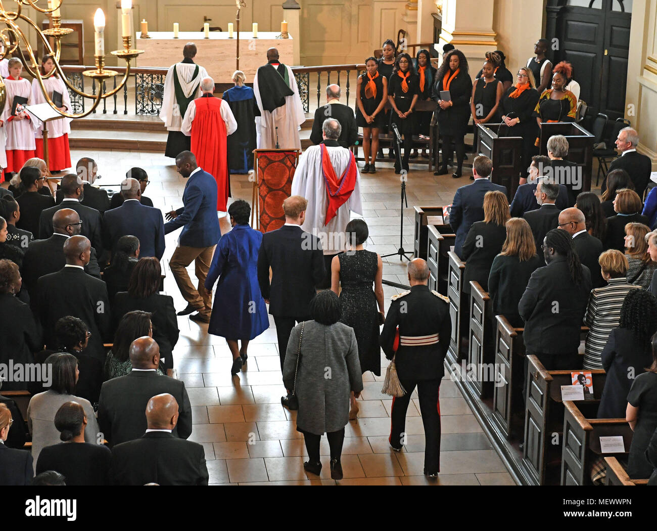 Baroness Lawrence with Prince Harry and Meghan Markle walk down the isle as they arrive for a memorial service at St Martin-in-the-Fields in Trafalgar Square, London, to commemorate the 25th anniversary of the murder of Stephen Lawrence. Stock Photo
