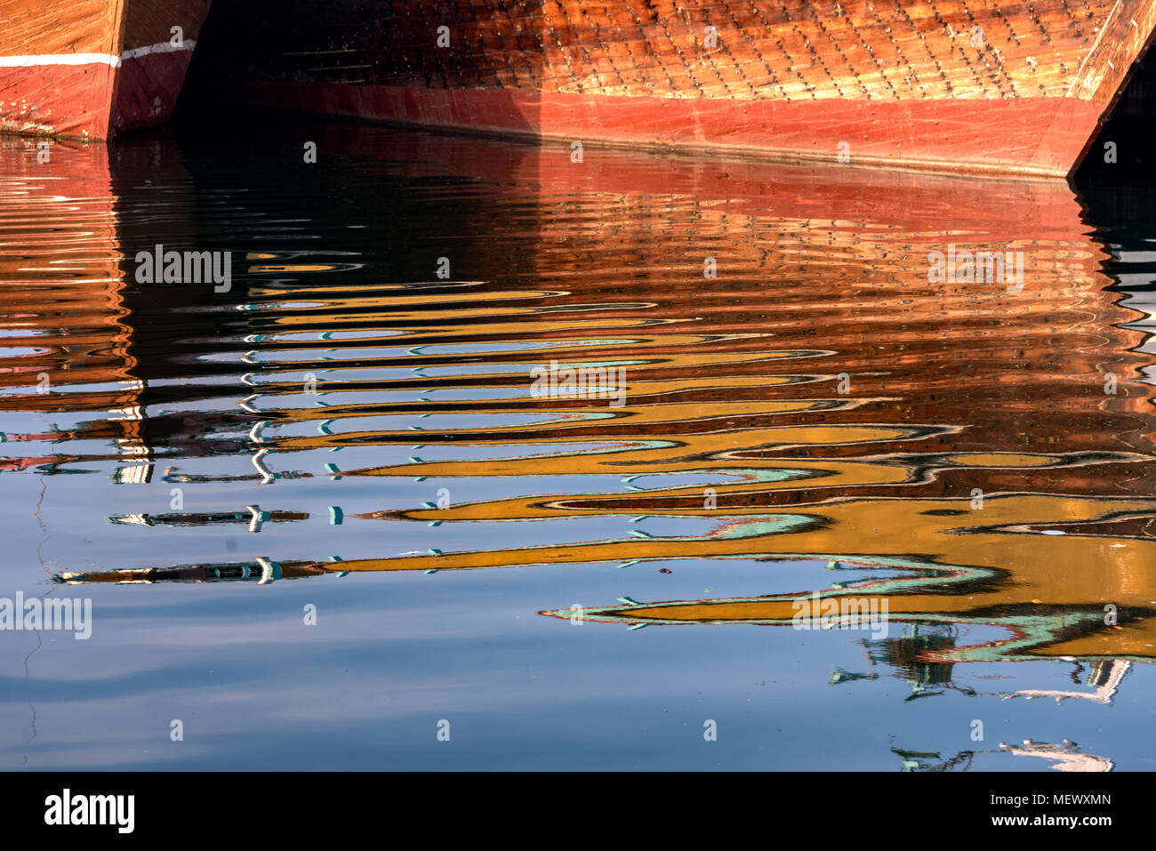 Shapes and pattern of Dubai boats reflecting in water. Stock Photo