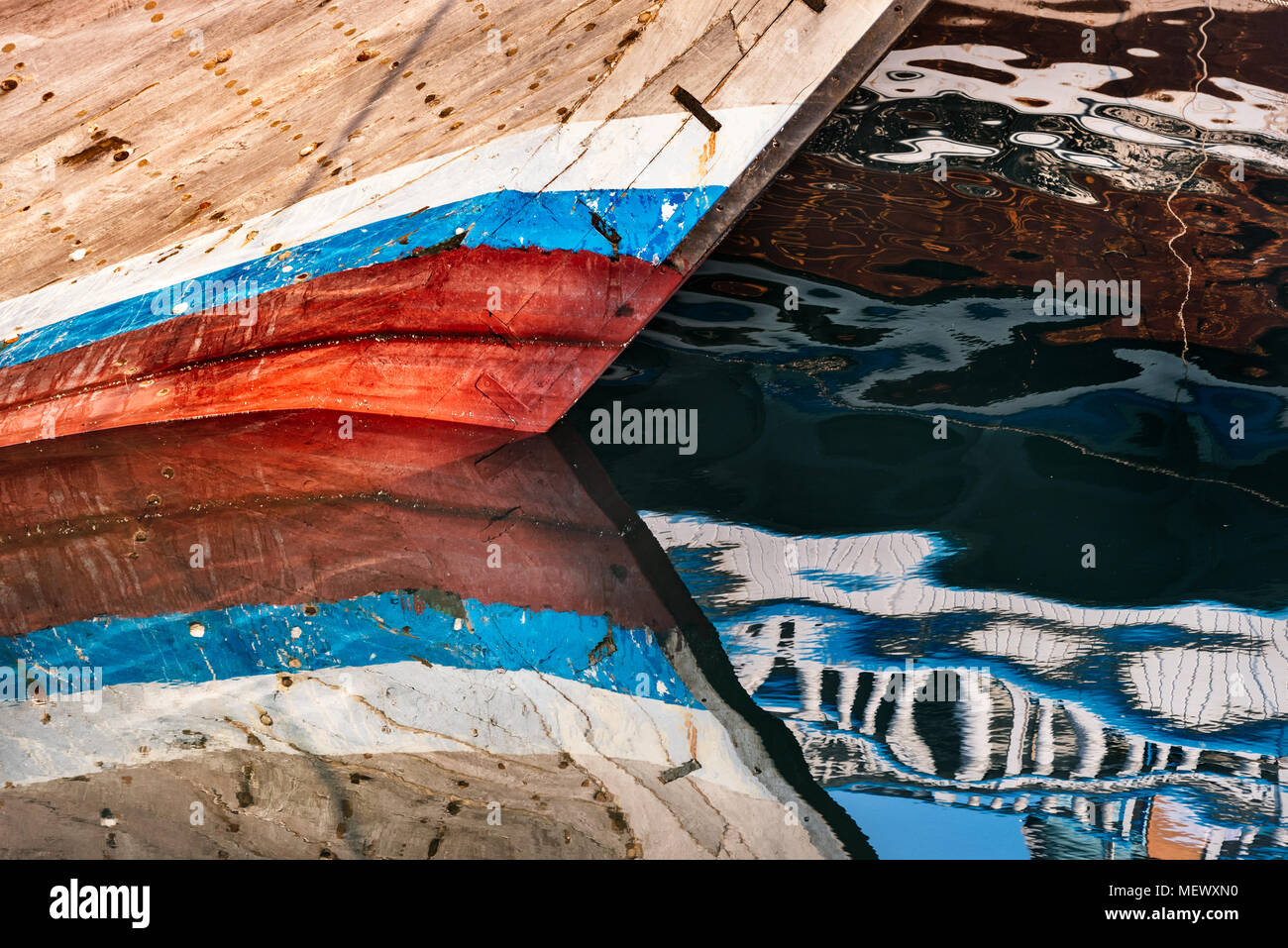Boats and its abstract reflection in water Stock Photo - Alamy