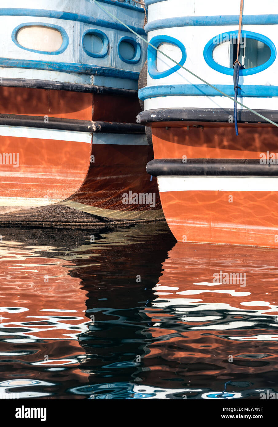 Pattern of a passenger wooden boat and its reflection in Dubai canal near Creek. Stock Photo