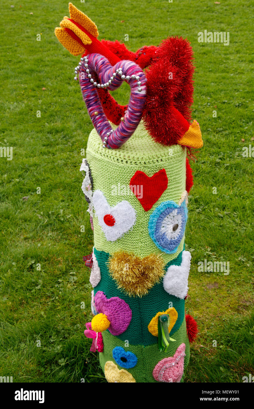 Knitted love-hearts and arrow in the grounds of the Yarndale event, Skipton, North Yorkshire, UK. Stock Photo