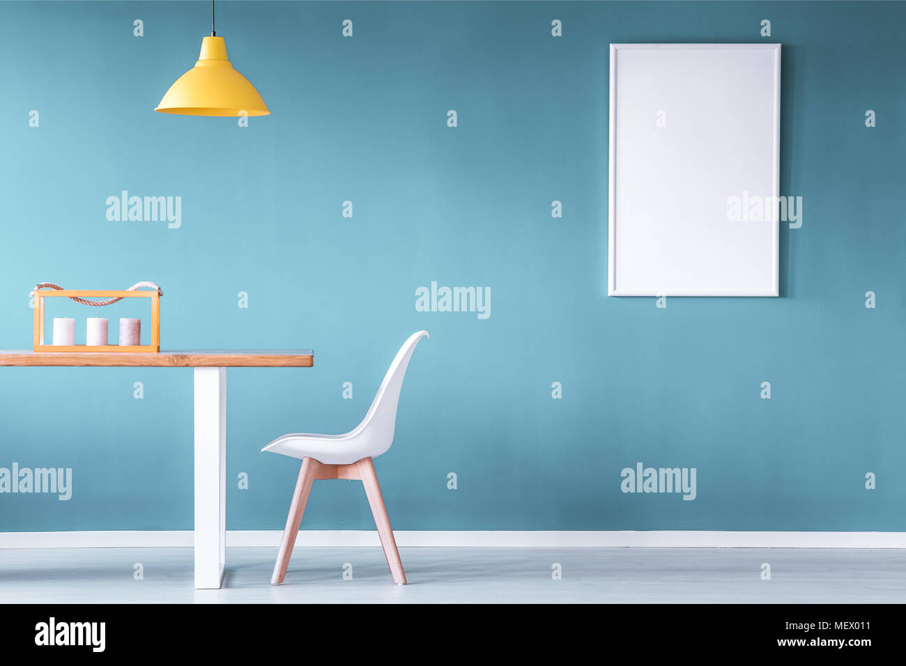 Download Mockup Of Poster In Blue Dining Room Interior With Yellow Lamp Above Wooden Table Next To White Chair Stock Photo Alamy PSD Mockup Templates