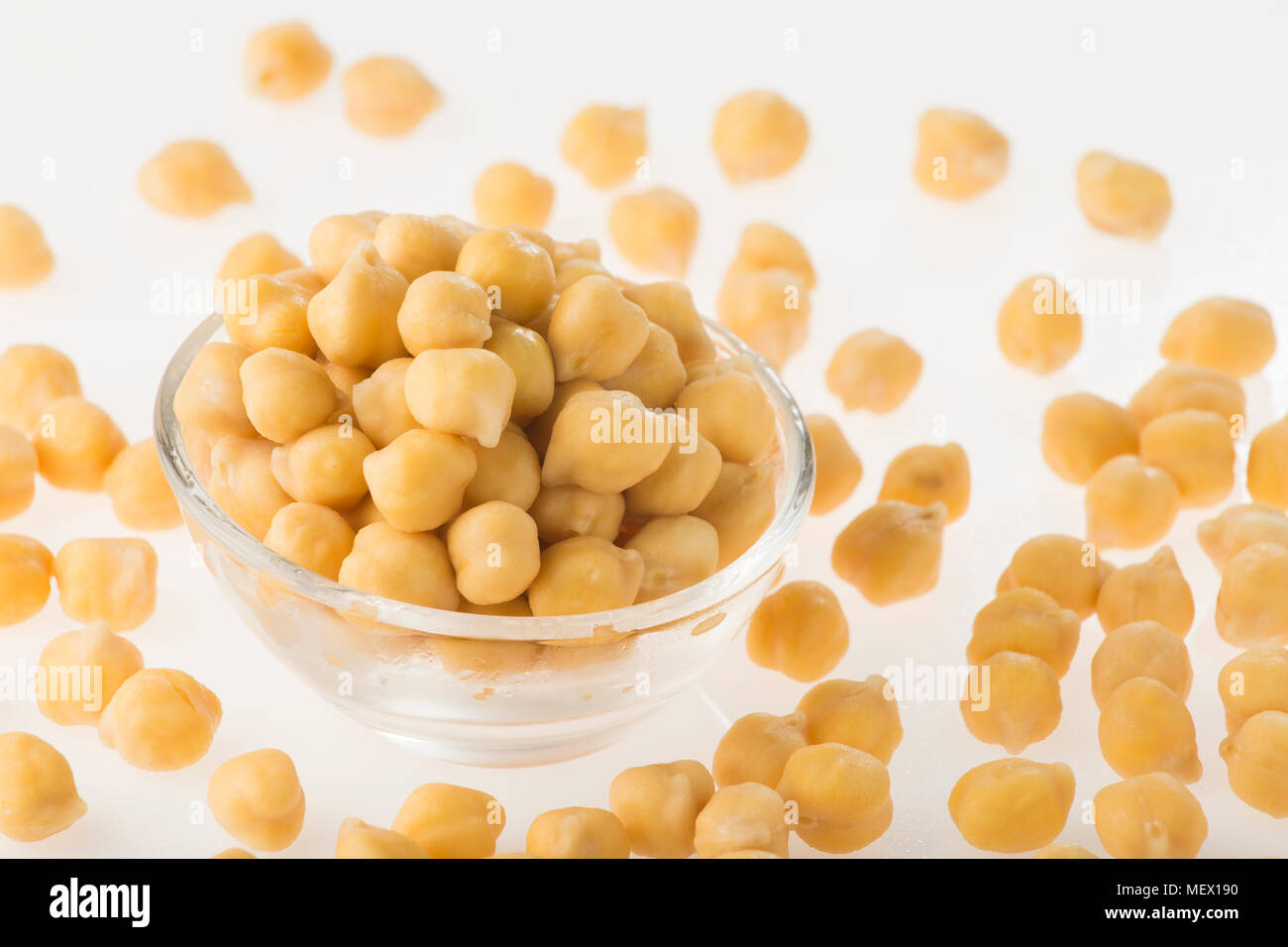 Chickpea grains (Cicer arietinum) in bowl isolated on white background Stock Photo