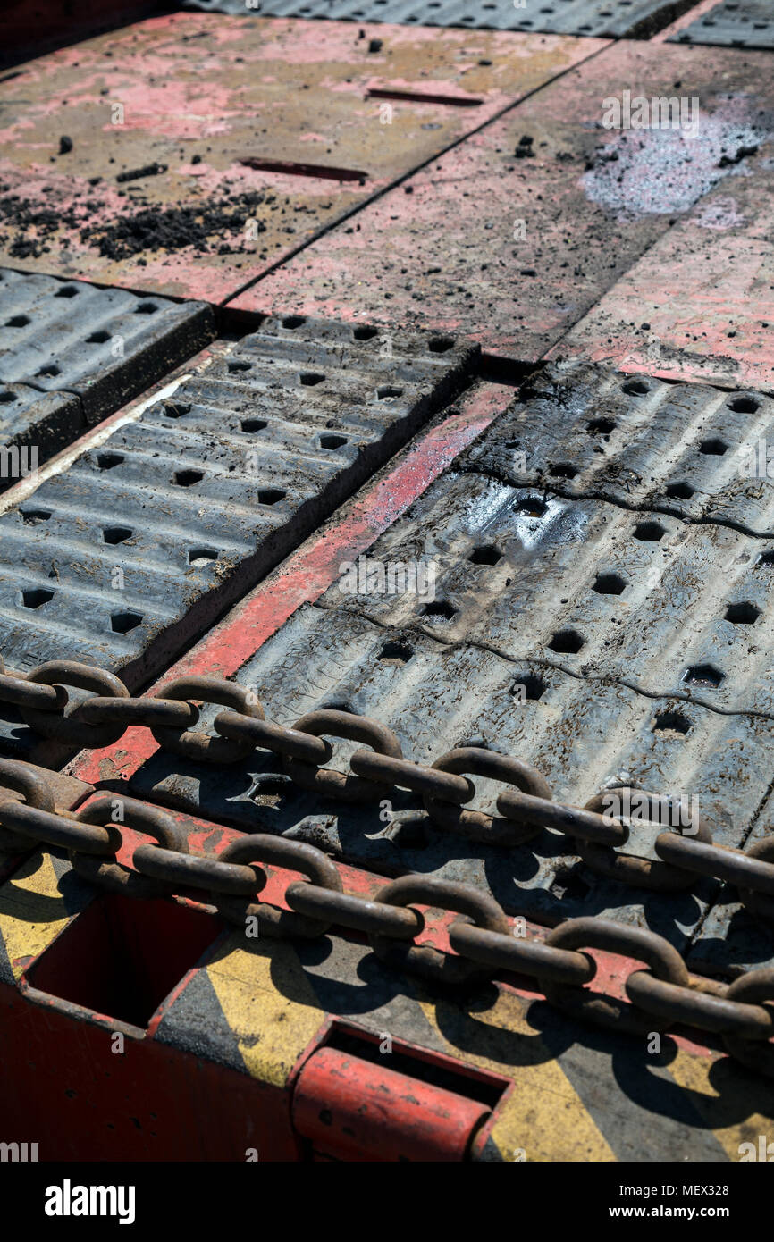 A large, heavy motor vehicle for transporting goods or troops; a truck.Back of a lorry Stock Photo