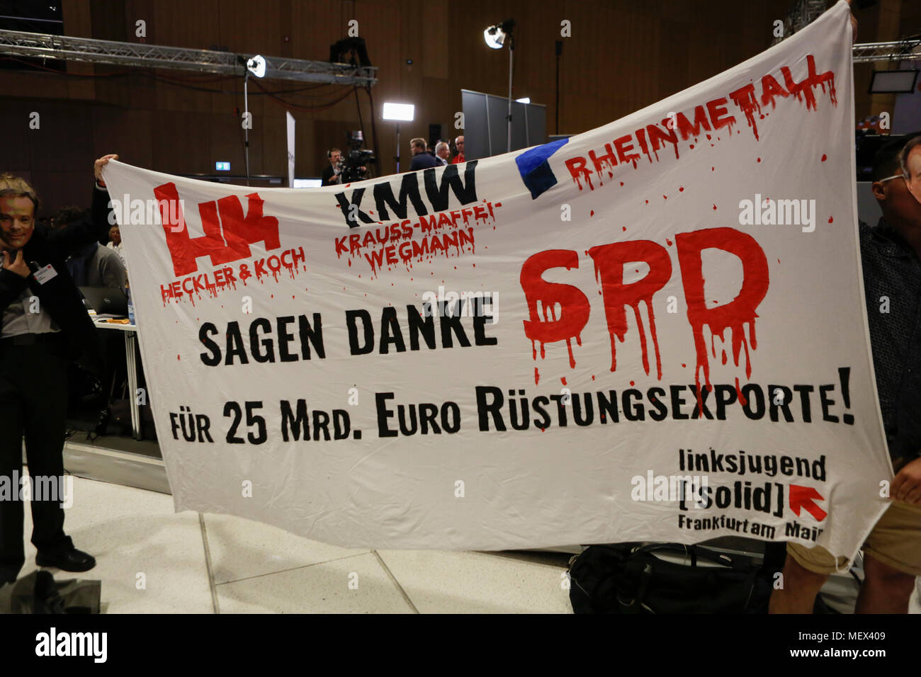 Wiesbaden, Germany. 22nd Apr, 2018. Members of the youth organisation of the party Die Linke (The Left) protest against weapons trade, in which they see the SPD as partial responsible. Andrea Nahles, the leader of the parliamentary party of the SPD in the Bundestag (German Parliament) has been elected as the new chairwoman of the SPD (Social Democratic Party of Germany). She won with 66% against her opponent Simone Lange in a contested election. She is the first women to lead the party in its 150 year long history. Credit: Michael Debets/Pacific Press/Alamy Live News Stock Photo