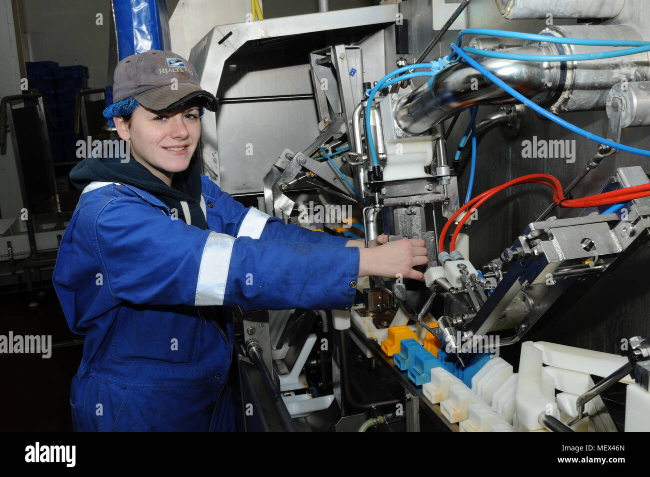 Female mechanical engineer working on machinery Stock Photo