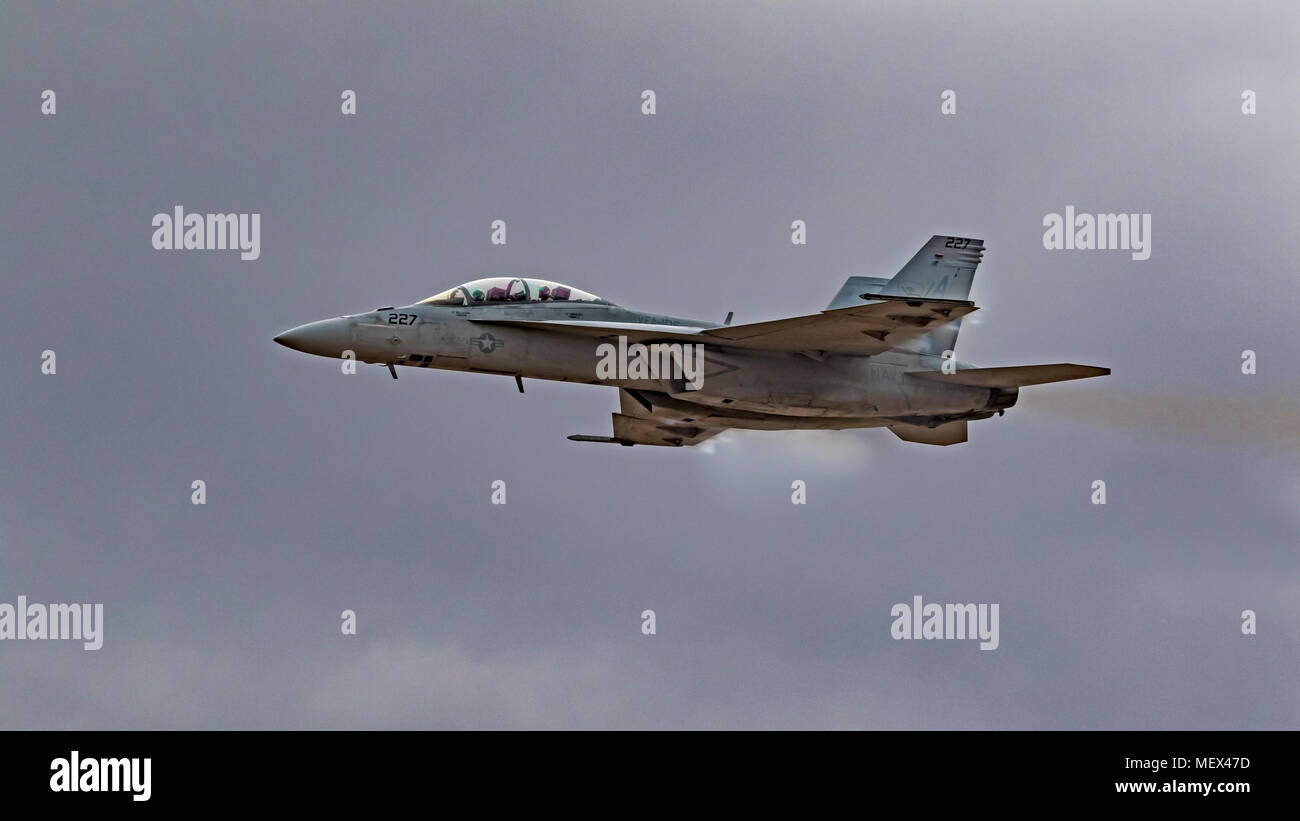 Airplane F-18 Hornet jet fighter with vapor Stock Photo