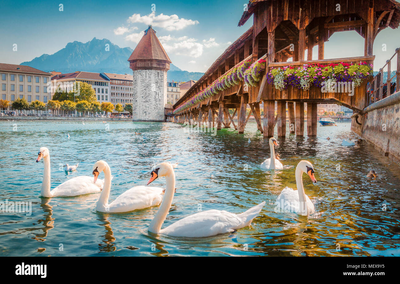 Historic city center of Lucerne with famous Chapel Bridge, the city's symbol and one of the Switzerland's main tourist attractions, and Mount Pilatus  Stock Photo