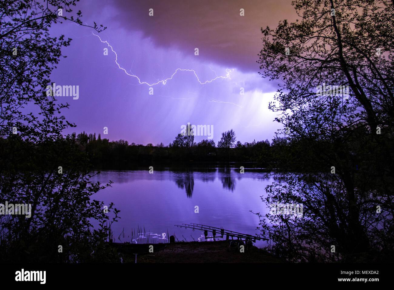 Lightning bolt as summer storm passes over carp fishing lake, Marlow, England, United Kingdom Stock Photo