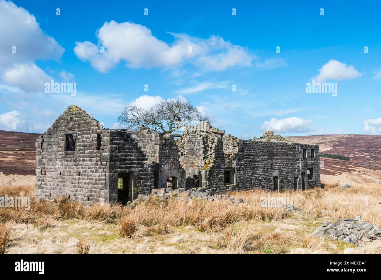 A derelict abandoned and Edwardian farmhouse on the moorland of Calderdale in West Yorkshire Stock Photo