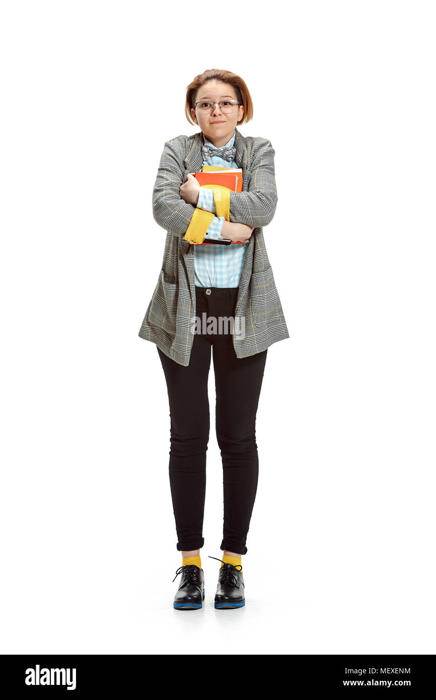 Full length portrait of a happy smiling female student holding books ...