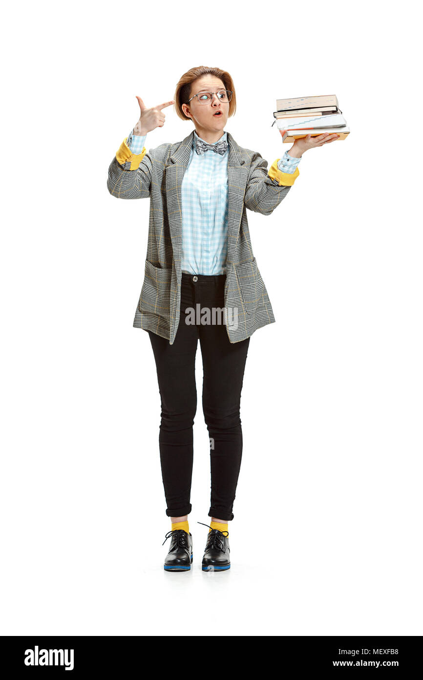 Full length portrait of a happy smiling female student holding books ...